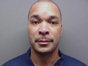 In this undated photo released by the Michigan Department of Corrections, Gregory Green is shown. The bodies of two young children and two teenagers were found at a Dearborn Heights, Mich., home early Wednesday, Sept. 21, 2016 after Green called 911 to report that he had killed them, police said. Two girls, ages 4 and 5, were asphyxiated in a car using exhaust, while a 17-year-old girl and a 19-year-old male were fatally shot. Green's wife was shot and stabbed but is in stable condition and is expected to survive. Green, 49, is in custody. Green had served 16 years in prison for second-degree murder — the fatal stabbing of his pregnant wife in 1991, records show. (Michigan Department of Corrections)