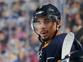 Evander Kane of the Buffalo Sabres watches the action against the Toronto Maple Leafs during an NHL game on Oct. 21, 2015 at the First Niagara Center in Buffalo. (Bill Wippert/NHLI via Getty Images)