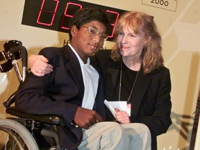 In this Sept. 27, 2000 file photo, actress Mia Farrow poses with her adopted son Thaddeus as they participate in the global summit on polio eradication at United Nations headquarters. Thaddeus Wilk Farrow, died, Wednesday, Sept 21, 2016. (AP Photo/Richard Drew, File)
