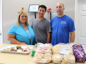 Kelly, Jeremy and John Dattolo are pictured here with a selection of breads and desserts at Dattolo's Baked Goods. The London family recently opened a Sarnia shop to serve up Lanthier bread and locally-made desserts. (Barbara Simpson/Sarnia Observer/Postmedia Network)