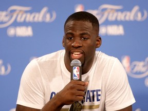 Draymond Green of the Golden State Warriors speaks to members of the media after being defeated by the Cleveland Cavaliers in Game 7 of the 2016 NBA Finals. (Ronald Martinez/Getty Images)