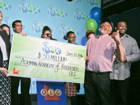 Ashman Kennedy, of Kitchener, collects his $30 million share of the Sept. 16, 2016 Lotto Max draw on Thursday, September 22, 2016. (Veronica Henri/Toronto Sun)