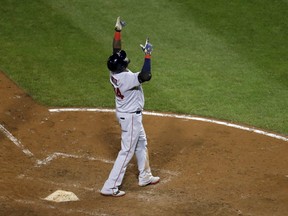 Boston Red Sox's David Ortiz gestures after crossing home plate on a three-run home run in the seventh inning of a baseball game against the Baltimore Orioles in Baltimore, Tuesday, Sept. 20, 2016. (AP Photo/Patrick Semansky)