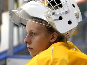 Goalie Zach Moore watches a Kingston Frontenacs practice from the bench at the Rogers K-Rock Centre this month. (Ian MacAlpine /The Whig-Standard)