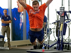 Edmonton Oilers goalie Laurent Brossoit leaps in the gym during team training camp physical testing at Rogers Place in Edmonton on Thursday September 22, 2016. (Photo by Larry Wong/Postmedia)