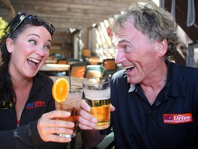 Kerri Salki (l) and Tom McGouran toast each other on a local patio in Winnipeg, Man. Thursday September 22, 2016. The pair will be co-hosting The Drive on 94.3FM starting Monday.