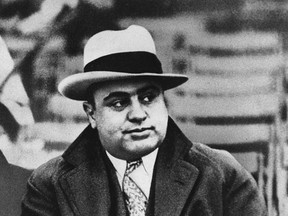 This Jan. 19, 1931 file photo shows Chicago mobster Al Capone at a football game. An intimate letter he penned from prison suggests the ruthless racketeer had a soft side. The three-page letter, which is to be auctioned next week in Cambridge, Mass., is addressed to Capone's son, Albert "Sonny" Capone. The mobster signed it, "Love & Kisses, Your Dear Dad Alphonse Capone #85," which was his number at the Alcatraz prison in San Francisco Bay. (AP Photo/File)