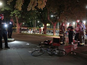 Emergency services at the scene of a shooting at the intersection of Queen St. E. and Sherbourne St. around 9 p.m. on Sept. 22, 2016. A female victim was transported to hospital with serious injuries. (John Hanley/Special to the Toronto Sun)