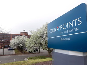 This Friday, March 25, 2016, photo shows the sign at the Four Points Sheraton Hotel in Richmond, Va. Marriott International closed early Friday, Sept. 23, 2016, on its acquisition of Starwood Hotels & Resorts Worldwide, bringing together its Marriott, Courtyard and Ritz-Carlton brands with Starwood’s Sheraton, Westin, W and St. Regis properties. (AP Photo/Steve Helber)
