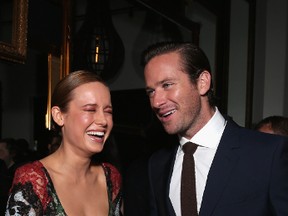 Actors Brie Larson and Armie Hammer having a laugh at the Free Fire premiere screening party hosted by Bulleit.