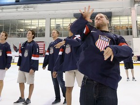 Phil Kessel of the Toronto Maple Leafs throws a t-shirt to fans following a press conference introducing the 2014 Olympic hockey team at the Kettler Capitals Iceplex on Aug. 27, 2013 in Arlington, Virginia. (Bruce Bennett/Getty Images)