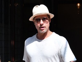Brad Pitt out and about in New York wearing a white outfit and hat. (TNYF/WENN.com)