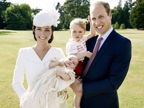This is a handout image released by Kensington Palace on Thursday July 9, 2015. shows Britain's Prince William, and Kate Duchess of Cambridge as they hold their children, Prince George, 2nd right, and Princess Charlotte in the grounds of Sandingham House in England after the christening of the princess on Sunday July 5, 2015. (Mario Testino/Art Partner/Kensington Palace via AP)
