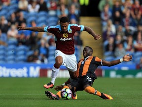 Burnley's Andre Gray (left) and Hull City's Adama Diomande battle for the ball during their English Premier League match in Burnley, England, on Sept. 10, 2016. (Clint Hughes/PA via AP)