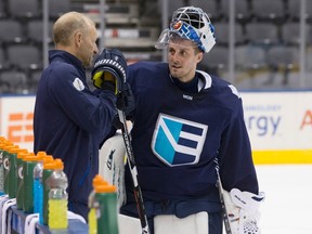 Team Europe head coach Ralph Krueger talks to goaltender Jaroslav Halak during a practice session at the World Cup of Hockey in Toronto Sept. 23, 2016. (THE CANADIAN PRESS/Chris Young)