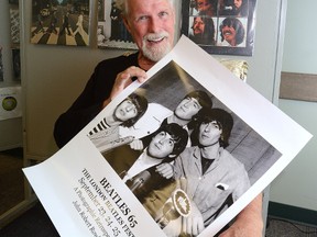 Photographer John Rowlands with a limited edition poster that will be available at this weekend's Beatles festival in London Ontario. Rowland's travelled with and photographed the band in their early days. Photo taken on Friday September 16, 2016. (MORRIS LAMONT, The London Free Press)