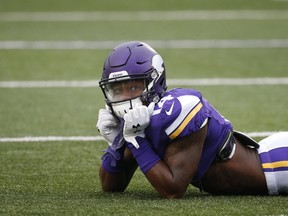 Minnesota Vikings wide receiver Stefon Diggs watches from the ground during warmups before an NFL football game against the Seattle Seahawks, in Minneapolis. (AP Photo/Ann Heisenfelt, File)