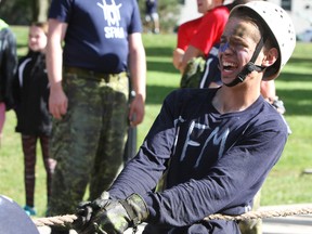 One squadron cadets pull a large military cargo truck during the annual First Year Orientation Program obstacle course at the Royal Military College of Canada in Kingston, Ont. on Friday September 23, 2016. Steph Crosier/Kingston Whig-Standard/Postmedia Network