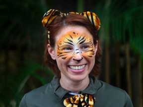 In this March 7, 2015, file photo, Stacey Konwiser smiles during the dedication of the new tiger habitat at the Palm Beach Zoo in West Palm Beach, Fla. Stacey Konwiser screamed for help into her radio before she was fatally attacked by a Malayan tiger, but the 350-pound animal crushed her neck before her co-workers could reach her, an autopsy report released Friday, Sept. 23, 2016. (Brianna Soukup/Palm Beach Post via AP, File)