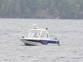 A marine unit from the Greater Sudbury Police takes part in a search on Thursday, Sept. 22, after a float plane crashed on Fairbank Lake west of Lively, Ont. on Wednesday evening. John Lappa/Sudbury Star