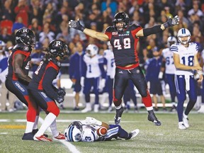 Redblacks defensive lineman Ettore Lattanzio celebrates after tackling running back Brandon Whitaker of the visiting Argos last night at TD Place in Ottawa. The Redblacks came away with  29-12 victory. (ERROL McGIHON, Postmedia Network)