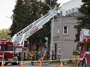 Edmonton Fire Rescue Service firefighters respond to a fire in a building at 86 Street and 112 Avenue in Edmonton, Alberta on Friday, September 23, 2016. Ian Kucerak / Postmedia