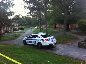 Police block off a large section of a townhome community on Elmira Drive after a man was killed, Sept. 24, 2016.  (Kirstin Endemann, Postmedia News)
