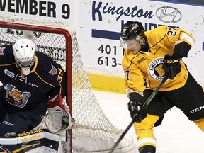 Kingston Frontenacs Cody Caron tries a wraparound on Barrie Colts goalie David Ovsjannikov during Ontario Hockey League action at the Rogers K-Rock Centre on Friday September 23 2016. Ian MacAlpine /The Whig-Standard