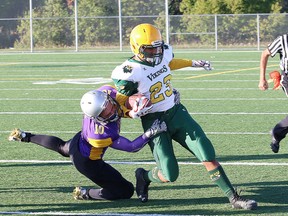 Darcy Labelle, left, of the Lo-Ellen Knights, tackles Oliver Sterling, of the Lockerby Vikings, during high school senior boys football action at James Jerome Sports Complex on Friday. John Lappa/Sudbury Star