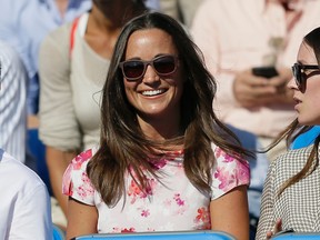 In this Friday, June 19, 2015 file photo, Pippa Middleton, left, the sister of Kate, the Duchess of Cambridge, watches the quarterfinal tennis match between Canada's Milos Raonic and France's Gilles Simon on the fifth day of the Queen's Championships in London. London police said Saturday, Sept. 24, 2016, they are investigating the reported hacking of the iCloud account of Pippa Middleton, younger sister of Catherine, Duchess of Cambridge. (AP Photo/Tim Ireland, File)