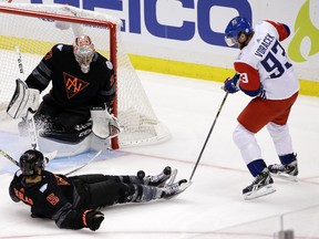 North America's Aaron Ekblad (5) blocks a shot by Czech Republic's Jakub Voracek (93) in front of North America's goalie Connor Hellebuyck (37) during the third period of a World Cup of Hockey exhibition game Wednesday, Sept. 14, 2016. The Czech Republic won 3-2. (AP Photo/Gene J. Puskar)