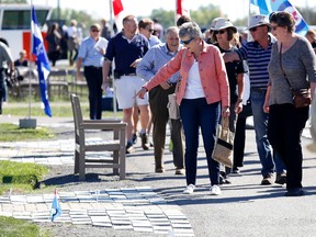 Visitors to the National Air Force Museum of Canada view Ad Astra stones in the air park on Saturday September 24, 2016 in Trenton, Ont. Emily Mountney-Lessard/Belleville Intelligencer/Postmedia Network