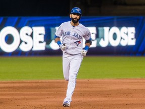 Blue Jays' Jose Bautista runs the bases on his three-run home run against the Yankees during the eighth inning of MLB action in Toronto on Saturday, Sept. 24, 2016. (Mark Blinch/The Canadian Press)