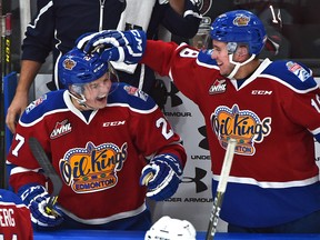 Edmonton Oil Kings Trey Fix-Wolansky (27) gets congratulated by teammate Kobe Mohr (18) for scoring the first goal in the new arena against the Red Deer Rebels in WHL action at Rogers Place, the first-ever hockey game in the new arena in Edmonton Saturday, September 24, 2016.