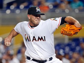 In this Friday, Sept. 9, 2016, file photo, Miami Marlins' Jose Fernandez pitches during the first inning of a baseball game against the Los Angeles Dodgers, in Miami. The Marlins announced Sunday, Sept. 25, 2016, that ace right-hander Fernandez has died. The U.S. Coast Guard says Fernandez was one of three people killed in a boat crash off Miami Beach early Sunday. (AP Photo/Wilfredo Lee, File)