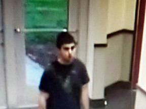 This Friday, Sept. 23, 2016 frame from surveillance video provided by the Washington State Patrol shows the suspect in a shooting rampage at the Cascade Mall in Burlington, Wash. him.(Washington State Patrol via AP)