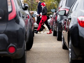 Susan Gegolick heads into The Edmonton Comic and Entertainment Expo dressed as the character Harley Quinn, at the Edmonton Expo Centre in Edmonton on Friday Sept. 23, 2016. Photo by David Bloom