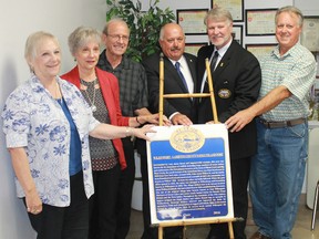 Heritage St. Clair's Wilkesport plaque was officially unveiled recently at the Wilkesport Community Hall. From left are Diane Rose, Shirley Sturdevant, Lawrence Sturdevant, Lambton County Deputy Warden Ian Veen, St. Clair Township Mayor Steve Arnold, and Heritage St. Clair chair David Pattenden. Carl Hnatyshyn/Postmedia Network
