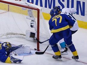 Team Europe Tomas Tatar slides the puck just past Sweden goalie Henrik Lundqvist during the OT at the semi-final at the World Cup of Hockey in Toronto on Sunday September 25, 2016. (Jack Boland/Toronto Sun/Postmedia Network)