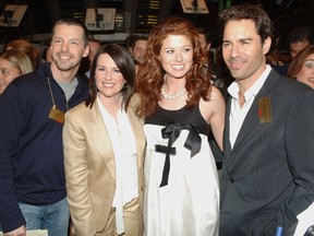 Sean Hayes, Megan Mullally, Debra Messing, and Eric McCormack from the Cast of 'Will and Grace' walk on the floor of the New York Stock Exchange on May 18, 2006 in New York City. (Photo by Brad Barket/Getty Images)