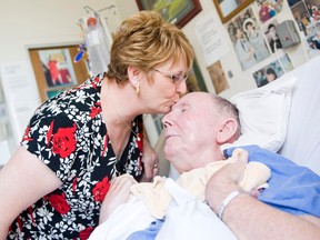 Edmonton - July 22, 2009 - Lesley Miller spends time with her husband Dougald Miller, who must live in a full time care facility due to injuries he received from a beating in 2002. Lesley has become an outspoken advocate for victims rights.