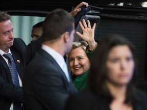Democratic presidential candidate Hillary Clinton waves as she arrives for a meeting with Israeli Prime Minister Benjamin Netanyahu in New York, Sunday, Sept. 25, 2016. (AP Photo/Matt Rourke)