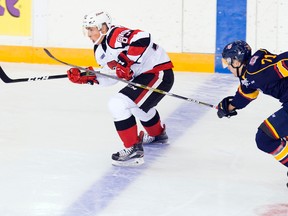 The Ottawa 67's Sasha Chmelevski tries to get away from Kirill Nizhnikov of the Barrie Colts at TD Place arena on Sept. 25. (Ashley Fraser, Postmedia Network)