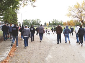 County Central High School students start the Terry Fox Run on the gravel road past the Cultural-Recreational Centre Friday morning.