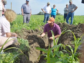 Blake Vince shows the LTVCA’s Farm to Coast tour soil from the no-till part of his land. Vince experiments with biodiverse cover crops and says along with no-till practices, they can help prevent toxic algae blooms in Lake Erie.