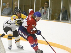 Soo Eagles Jacob Palmiero chases down Rayside Balfour Canadians Danny Lepage during first period NOJHL action from the Chelmsford Arena on Sunday. Gino Donato/Sudbury Star