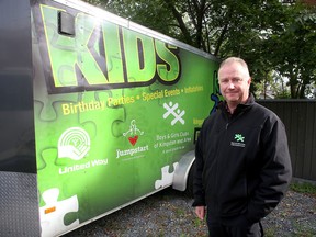 Harold Parsons, executive director with the Boys and Girls Club of Kingston, in front of a trailer where three generators that were stolen had been stored. (Ian MacAlpine/The Whig-Standard)