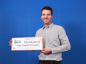 Boris Coquerel, of Toronto, collects his half of the Sept. 16 $60-million Lotto Max jackpot. (Submitted)