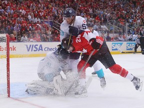 Roman Josi of Team Europe hangs on to Claude Giroux of Team Canada in the crease during the first period at the World Cup of Hockey tournament at the Air Canada Centre on Sept. 21, 2016. (Bruce Bennett/Getty Images)
