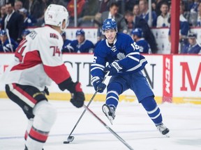 Toronto Maple Leafs' Mitch Marner tires to deke past Ottawa Senators defenceman Mark Borowiecki during pre-season NHL action in Halifax on Sept. 26, 2016. (THE CANADIAN PRESS/Darren Calabrese)